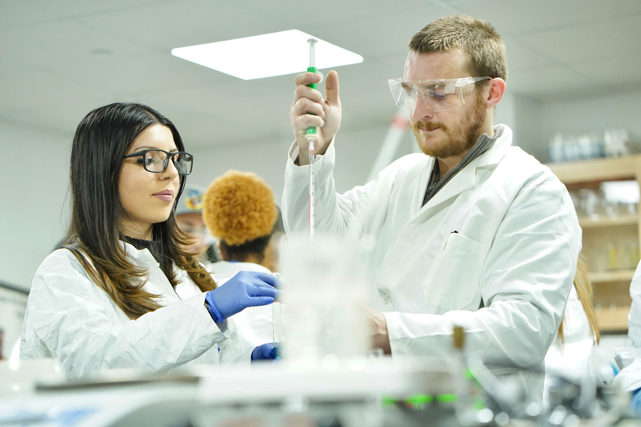 two students working in biology lab