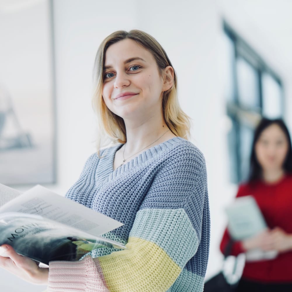 female students holding psychology books