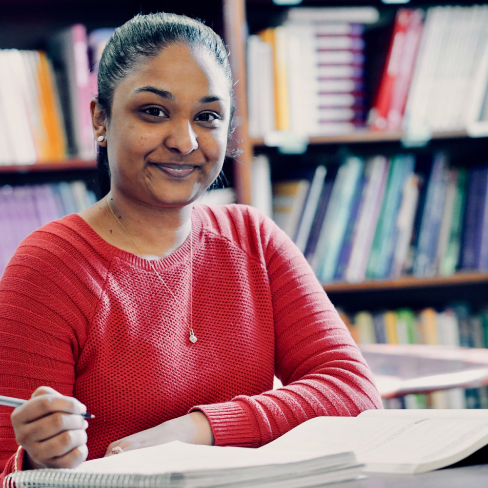 female student working in library